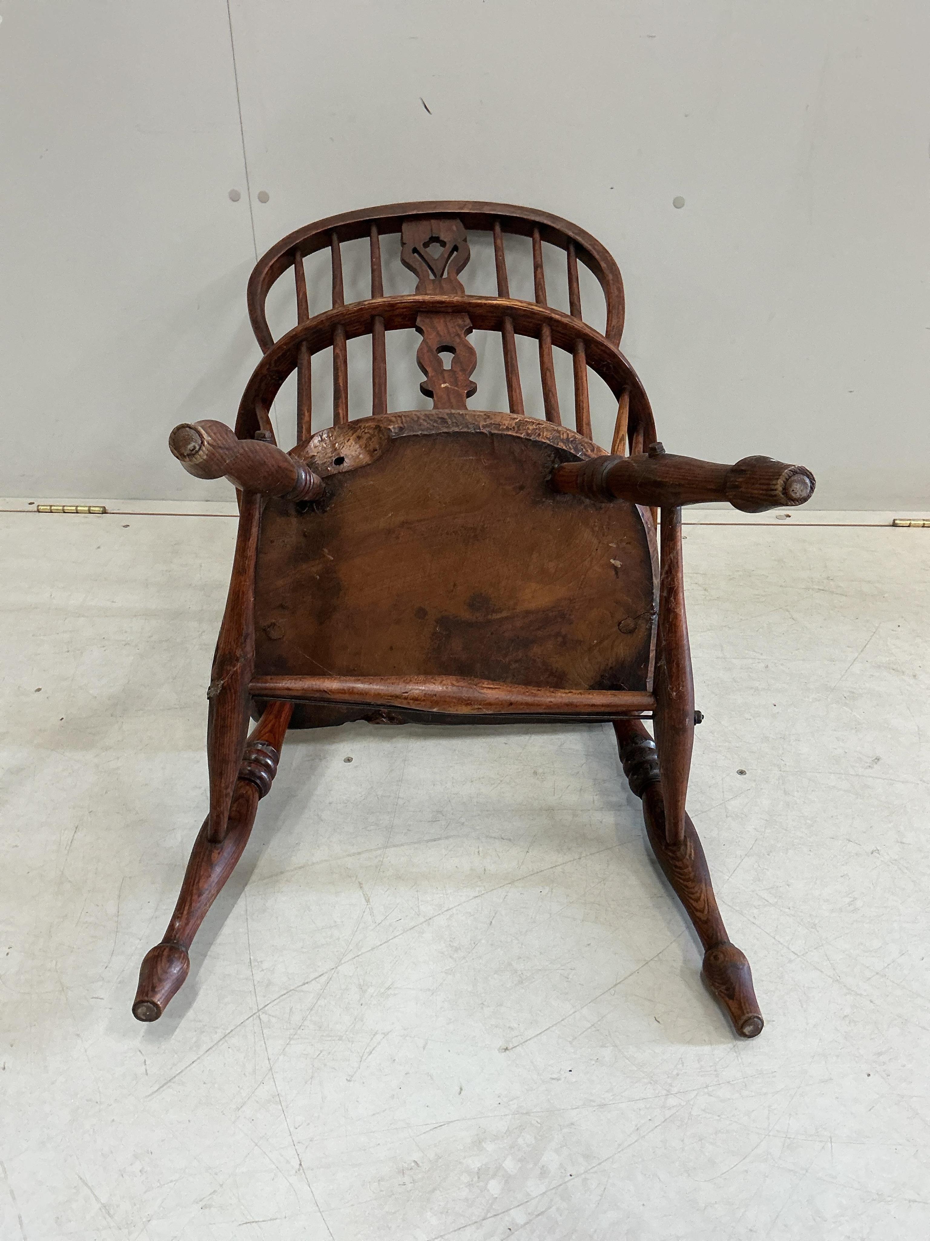 A mid 19th century Thames Valley elm and beech comb back Windsor elbow chair, width 55cm, depth 36cm, height 92cm